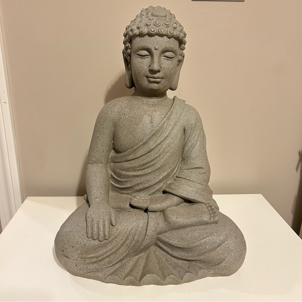 Buddha statue, often used as a decorative or religious object.